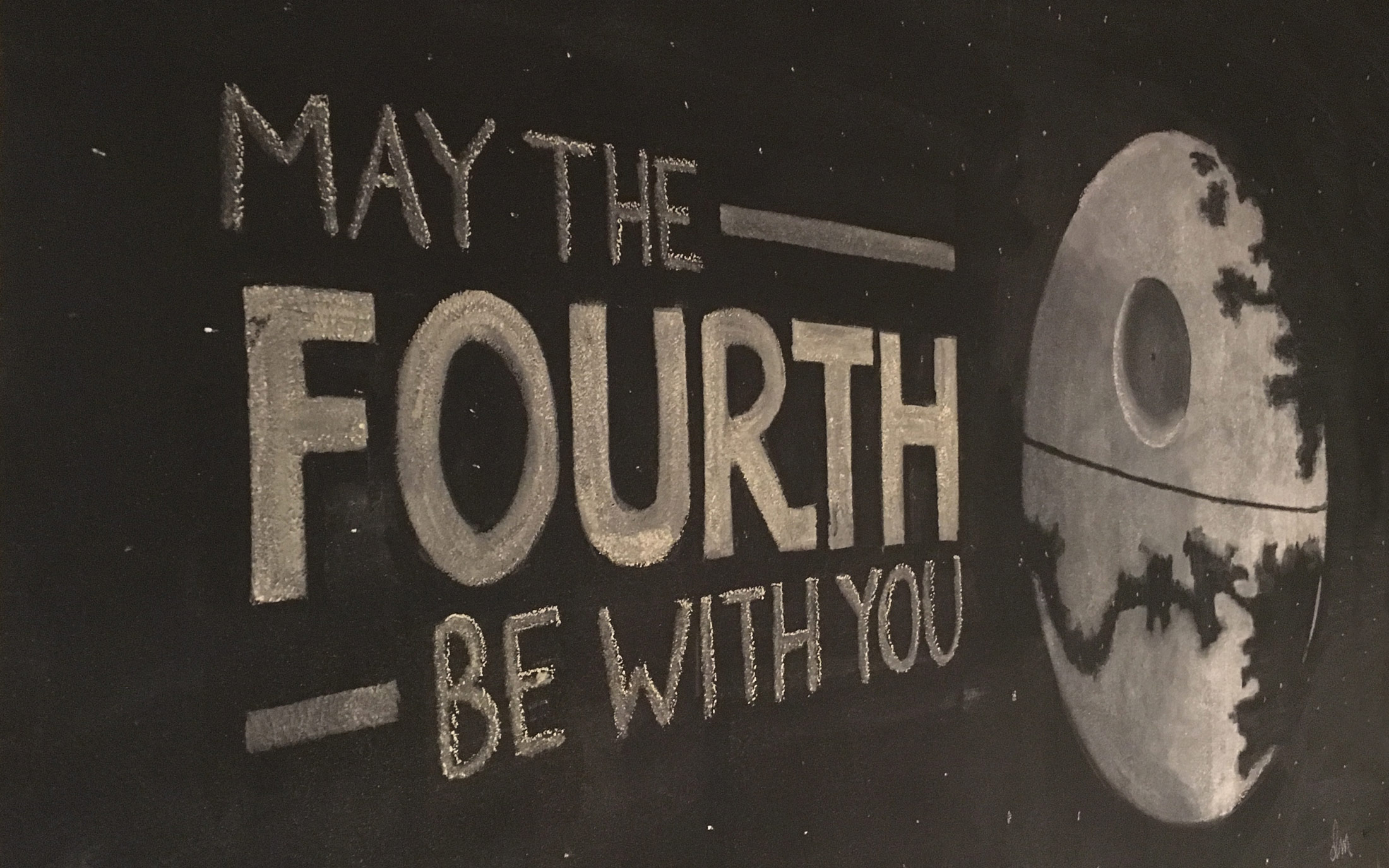 Chalk drawing of the Death Star under construction with the text "May the Fourth Be With You"